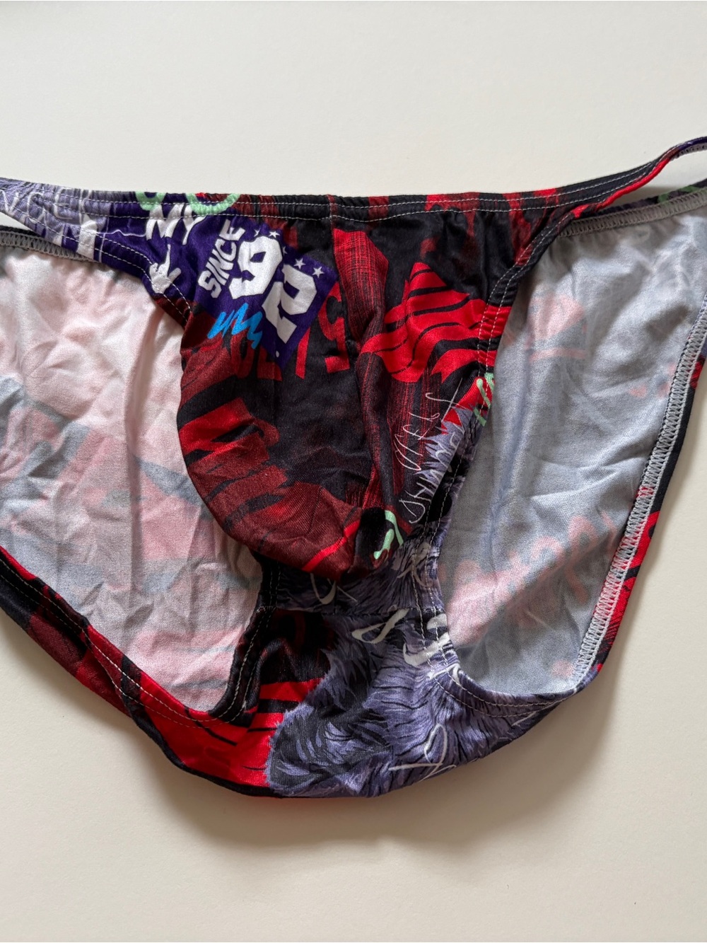 Men's Graphic Bikini Briefs with Bold Red & Black Print